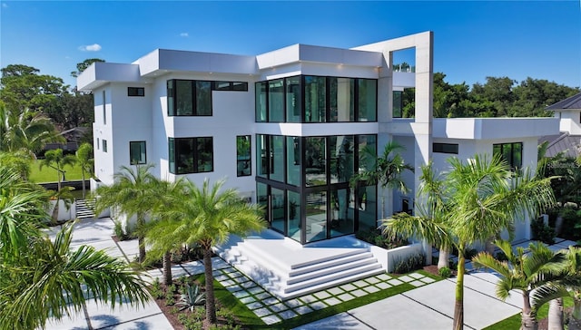 1610 N Lodge Dr, Sarasota, FL 34239 - rear view of house featuring stucco siding