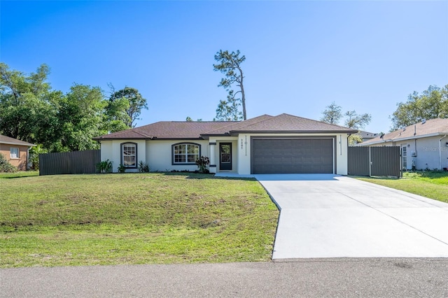 2405 Mistleto Ln, North Port, FL 34286 - single story home with a garage, driveway, and stucco siding