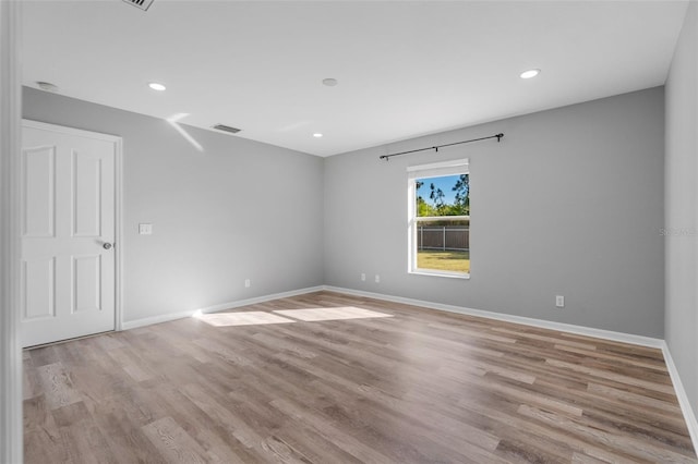 2405 Mistleto Ln, North Port, FL 34286 - unfurnished room with light wood-style floors and recessed lighting