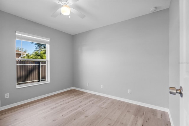 2405 Mistleto Ln, North Port, FL 34286 - unfurnished room with wood finished floors, a ceiling fan, and a smoke detector