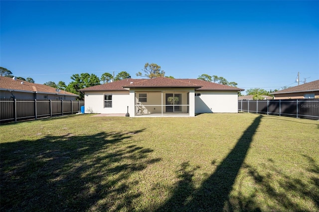 2405 Mistleto Ln, North Port, FL 34286 - rear view of house with a fenced backyard and stucco siding