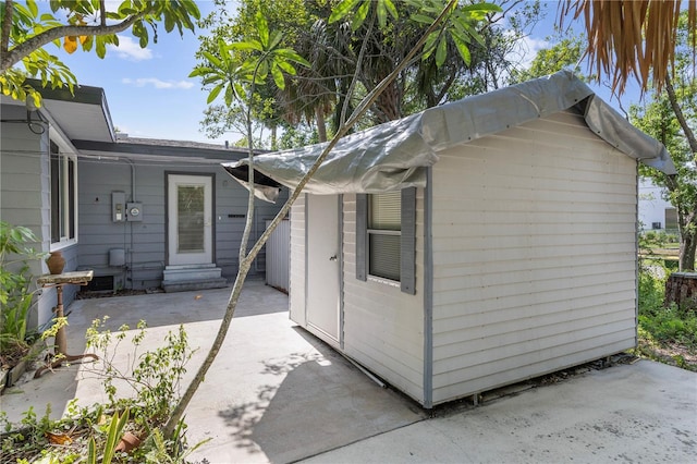 2850 Bon Air Ave, Sarasota, FL 34234 - view of side of home with a patio, entry steps, and an outdoor structure