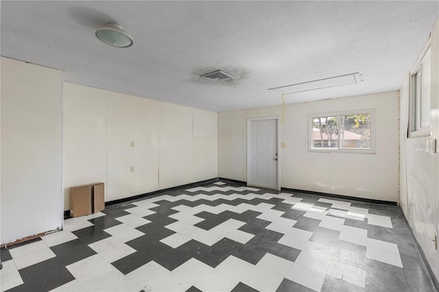2850 Bon Air Ave, Sarasota, FL 34234 - empty room with attic access and tile patterned floors