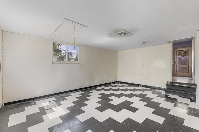 2850 Bon Air Ave, Sarasota, FL 34234 - empty room with attic access and tile patterned floors