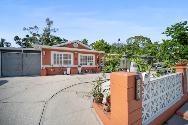 3957 Proctor Rd, Sarasota, FL 34233 - view of front of property featuring a garage, driveway, and stucco siding
