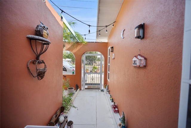 3957 Proctor Rd, Sarasota, FL 34233 - view of exterior entry featuring stucco siding and a gate
