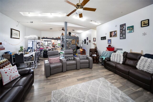 3957 Proctor Rd, Sarasota, FL 34233 - living area featuring a ceiling fan, wood finished floors, and vaulted ceiling