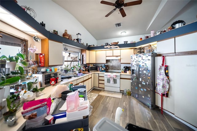 3957 Proctor Rd, Sarasota, FL 34233 - kitchen featuring refrigerator with ice dispenser, white electric range oven, lofted ceiling, under cabinet range hood, and light countertops