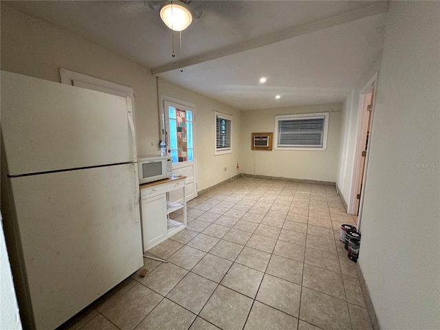 408 3rd Ave E Unit A, B & C, Bradenton, FL 34208 - kitchen featuring white appliances, light tile patterned floors, a wall unit AC, a ceiling fan, and white cabinets
