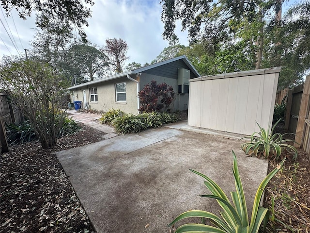 408 3rd Ave E Unit A, B & C, Bradenton, FL 34208 - rear view of house featuring stucco siding and a patio area