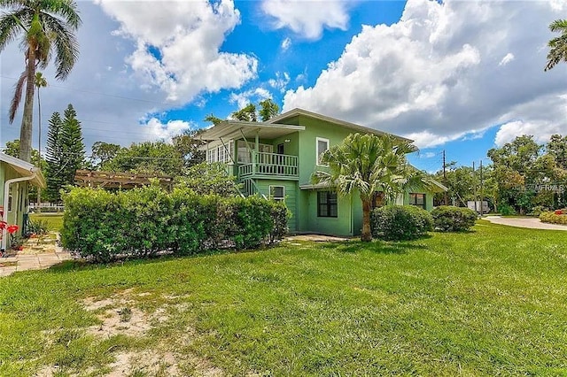 408 3rd Ave E Unit A, B & C, Bradenton, FL 34208 - view of property exterior featuring a yard and a balcony