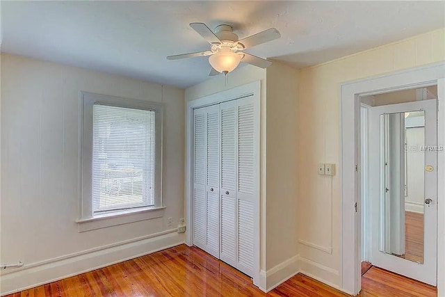 408 3rd Ave E Unit A, B & C, Bradenton, FL 34208 - unfurnished bedroom featuring a closet, light wood-style floors, and a ceiling fan