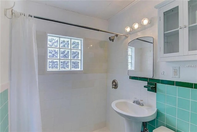 408 3rd Ave E Unit A, B & C, Bradenton, FL 34208 - bathroom featuring tiled shower and tile walls