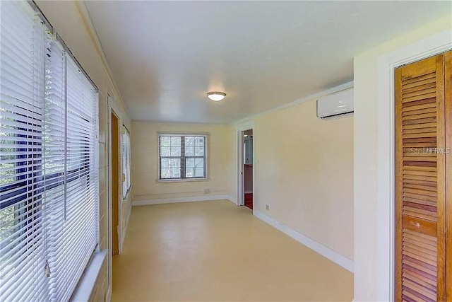 408 3rd Ave E Unit A, B & C, Bradenton, FL 34208 - unfurnished bedroom with a wall mounted air conditioner, finished concrete flooring, and a closet