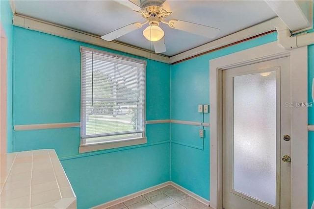 408 3rd Ave E Unit A, B & C, Bradenton, FL 34208 - tiled empty room featuring a ceiling fan and baseboards