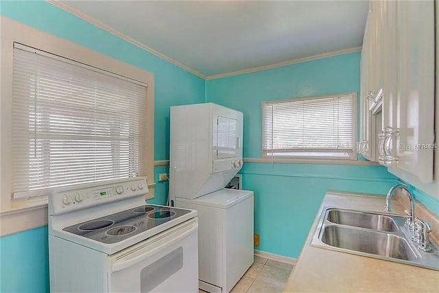 408 3rd Ave E Unit A, B & C, Bradenton, FL 34208 - washroom with estacked washer and dryer, crown molding, and light tile patterned flooring