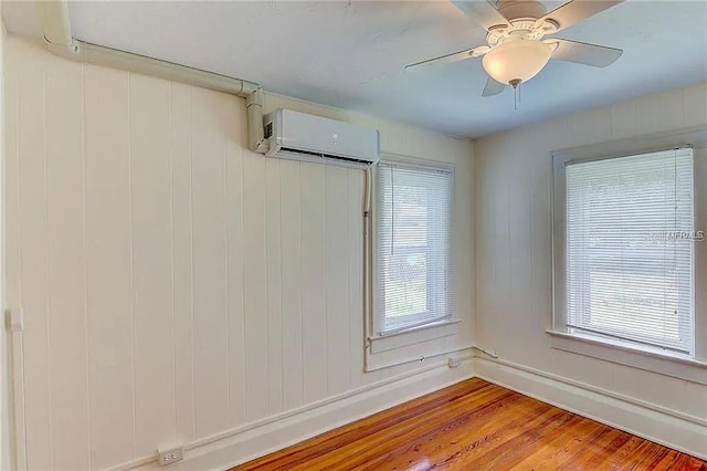 408 3rd Ave E Unit A, B & C, Bradenton, FL 34208 - unfurnished room with a wall mounted AC, wood finished floors, and ceiling fan