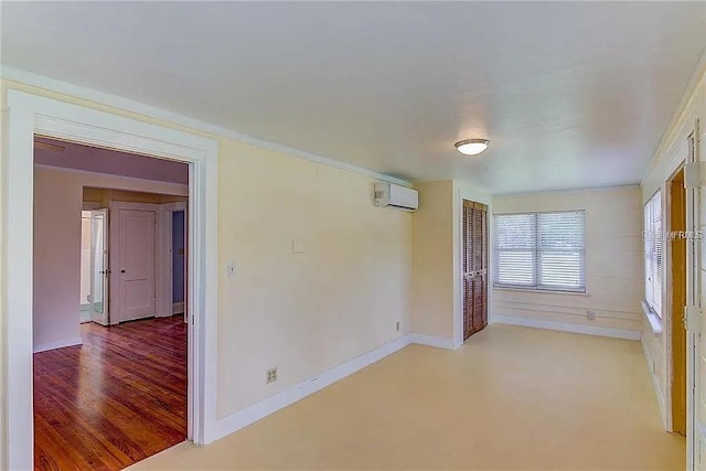 408 3rd Ave E Unit A, B & C, Bradenton, FL 34208 - spare room featuring a wall mounted AC and light wood-type flooring