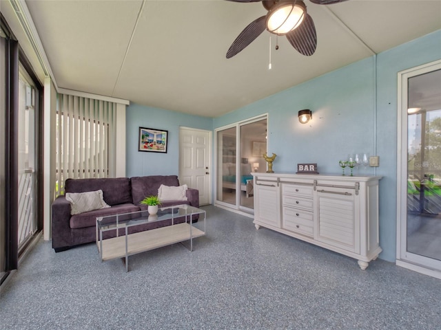 123 Tidy Island Blvd, Bradenton, FL 34210 - living area with light aggregate flooring and a ceiling fan