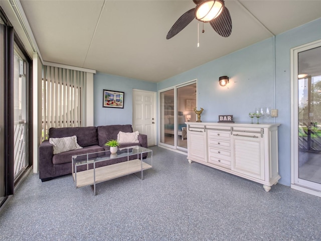 123 Tidy Island Blvd, Bradenton, FL 34210 - living room with a ceiling fan and speckle patterned floor