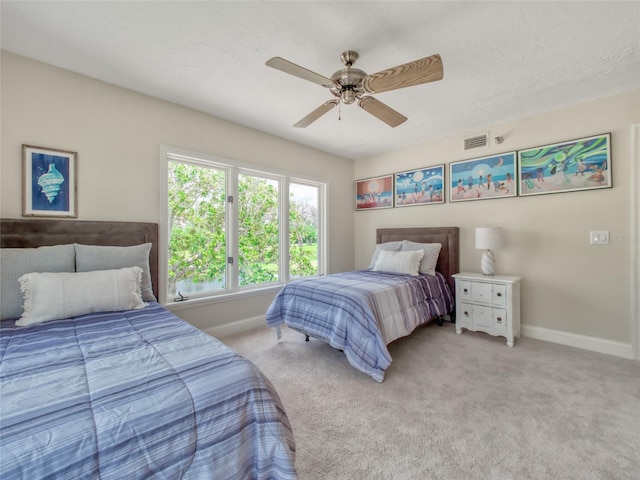 123 Tidy Island Blvd, Bradenton, FL 34210 - bedroom featuring a ceiling fan and light carpet