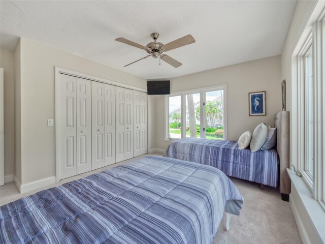 123 Tidy Island Blvd, Bradenton, FL 34210 - carpeted bedroom featuring ceiling fan and a closet