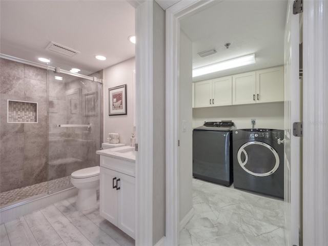 123 Tidy Island Blvd, Bradenton, FL 34210 - full bathroom with separate washer and dryer, a stall shower, vanity, and recessed lighting