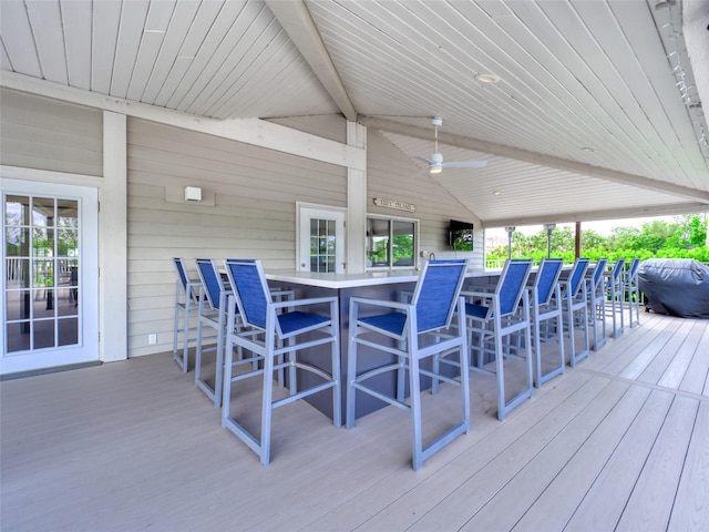 123 Tidy Island Blvd, Bradenton, FL 34210 - wooden terrace with exterior bar and a ceiling fan