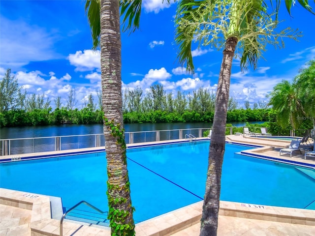 123 Tidy Island Blvd, Bradenton, FL 34210 - community pool with a water view, a patio, and view of scattered trees