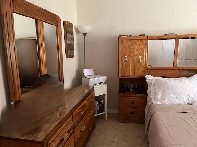 900 La Costa Cir Unit 4, Sarasota, FL 34237 - bedroom featuring light tile patterned floors