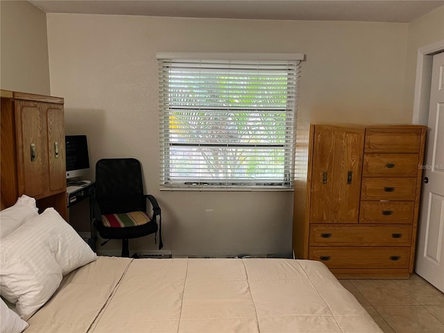 900 La Costa Cir Unit 4, Sarasota, FL 34237 - tiled bedroom with multiple windows