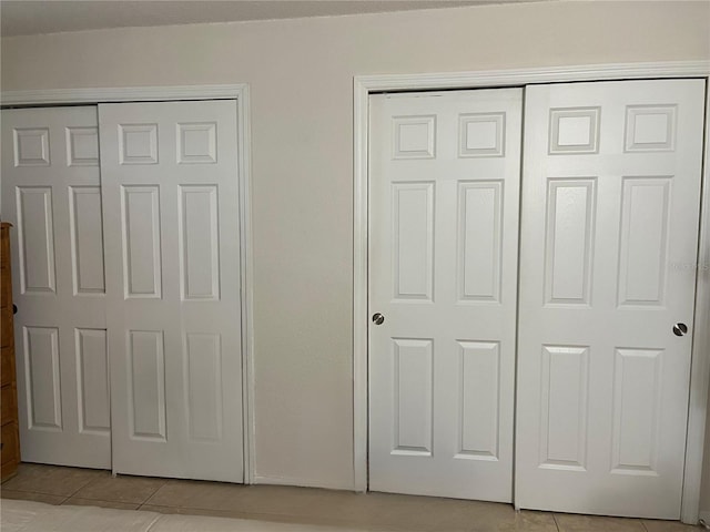 900 La Costa Cir Unit 4, Sarasota, FL 34237 - unfurnished bedroom with light tile patterned flooring