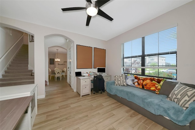 16231 Tradewind Ter, Bradenton, FL 34211 - office area featuring light wood-type flooring, arched walkways, plenty of natural light, and ceiling fan