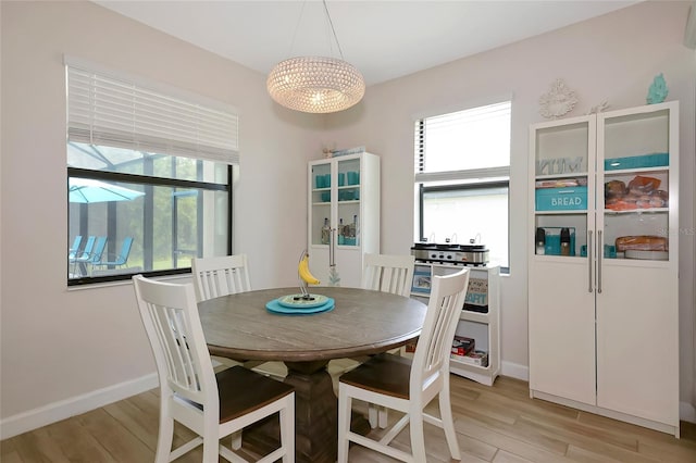 16231 Tradewind Ter, Bradenton, FL 34211 - dining space with a chandelier and light wood finished floors