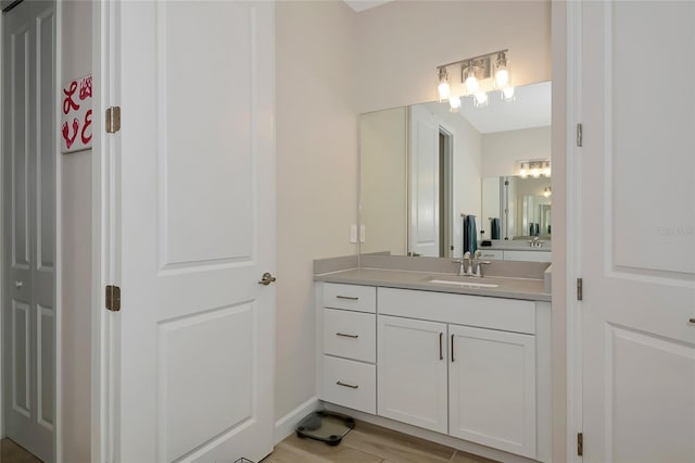 16231 Tradewind Ter, Bradenton, FL 34211 - bathroom with vanity and wood finished floors