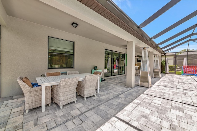 16231 Tradewind Ter, Bradenton, FL 34211 - view of patio featuring outdoor dining space and glass enclosure