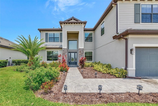 16231 Tradewind Ter, Bradenton, FL 34211 - view of front of home featuring stucco siding and a front yard
