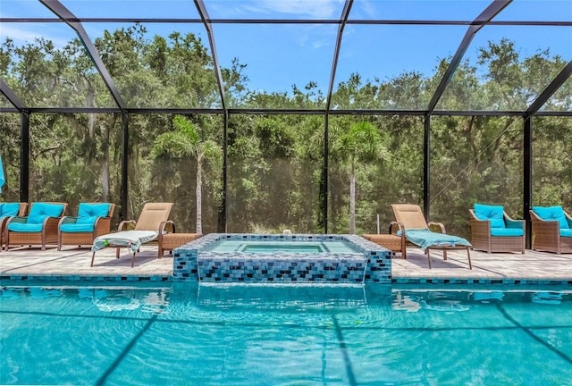 16231 Tradewind Ter, Bradenton, FL 34211 - outdoor pool featuring an in-ground hot tub, glass enclosure, and a patio