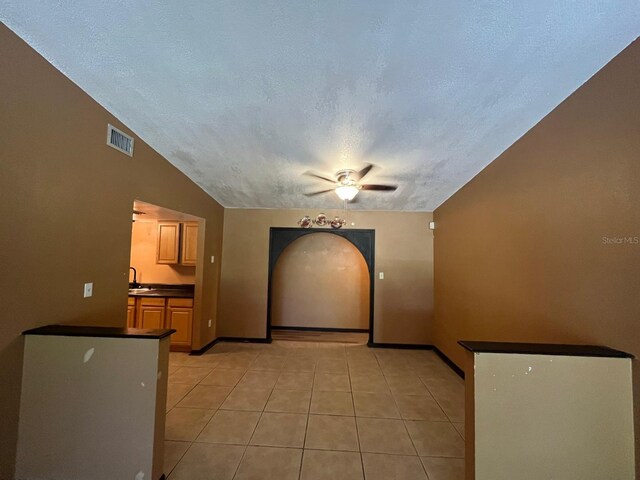 507 Cloudcroft Dr, Deltona, FL 32738 - spare room with ceiling fan, a textured ceiling, and light tile patterned floors
