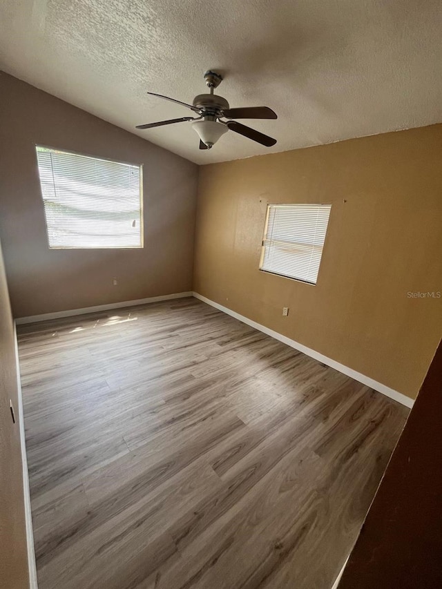 507 Cloudcroft Dr, Deltona, FL 32738 - unfurnished room with a textured ceiling, ceiling fan, and wood finished floors