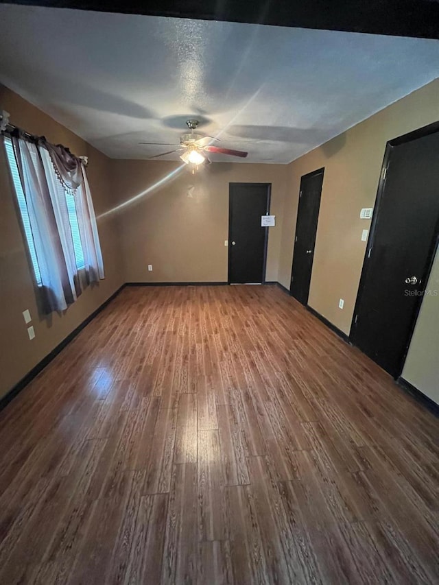 507 Cloudcroft Dr, Deltona, FL 32738 - unfurnished living room featuring wood finished floors and a ceiling fan