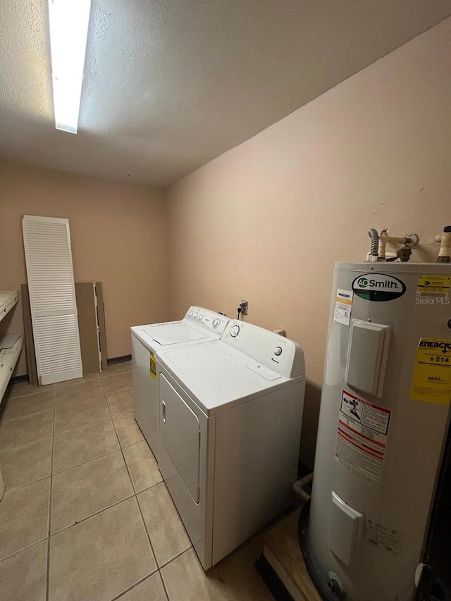 507 Cloudcroft Dr, Deltona, FL 32738 - laundry area featuring electric water heater, separate washer and dryer, and light tile patterned floors
