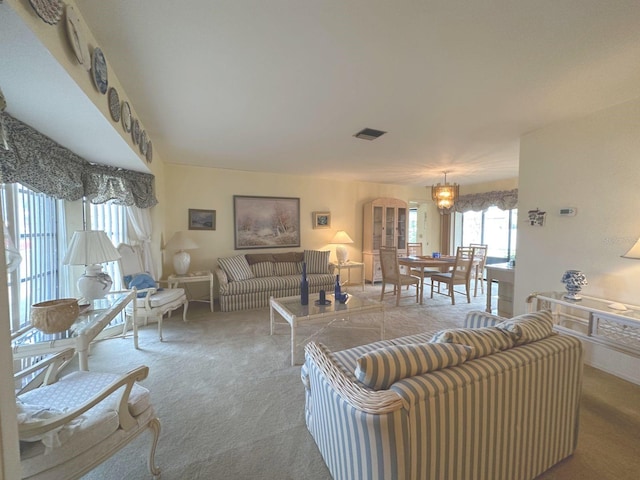 22321 Yonkers Ave, Port Charlotte, FL 33952 - living room featuring carpet floors and arched walkways