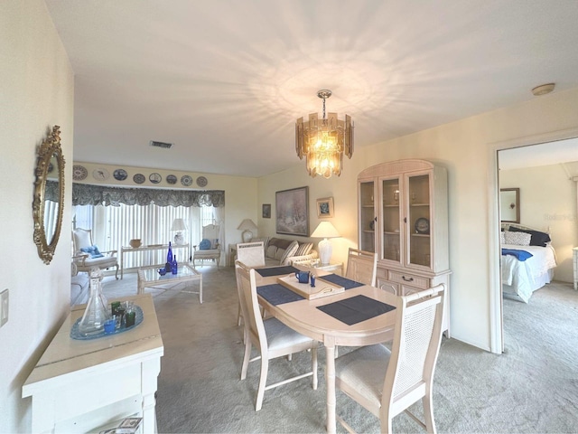 22321 Yonkers Ave, Port Charlotte, FL 33952 - dining space with light colored carpet and a chandelier