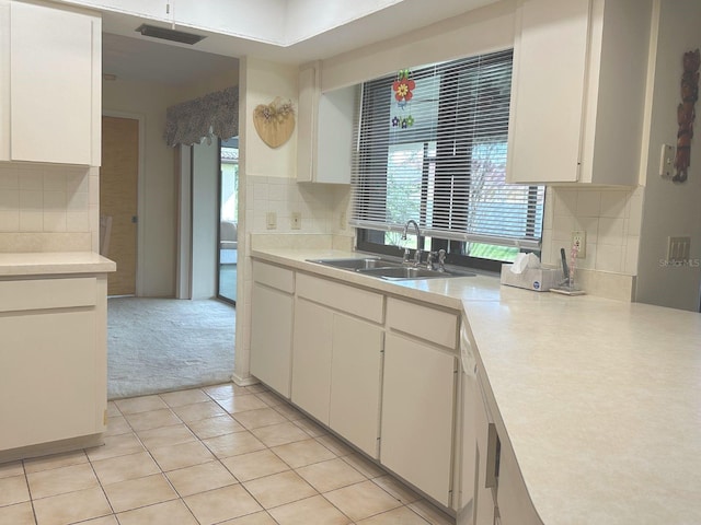 22321 Yonkers Ave, Port Charlotte, FL 33952 - kitchen featuring healthy amount of natural light, backsplash, and light countertops