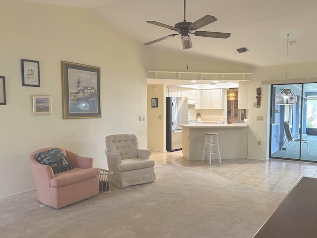 22321 Yonkers Ave, Port Charlotte, FL 33952 - living area with lofted ceiling, ceiling fan, and light tile patterned flooring