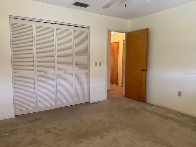 22321 Yonkers Ave, Port Charlotte, FL 33952 - unfurnished bedroom with a closet, light carpet, and a ceiling fan