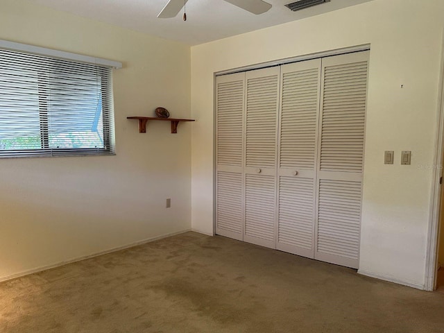 22321 Yonkers Ave, Port Charlotte, FL 33952 - unfurnished bedroom featuring carpet flooring, a closet, and ceiling fan