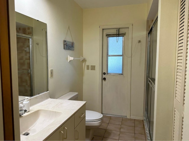 22321 Yonkers Ave, Port Charlotte, FL 33952 - bathroom featuring vanity, a stall shower, tile patterned floors, and a closet