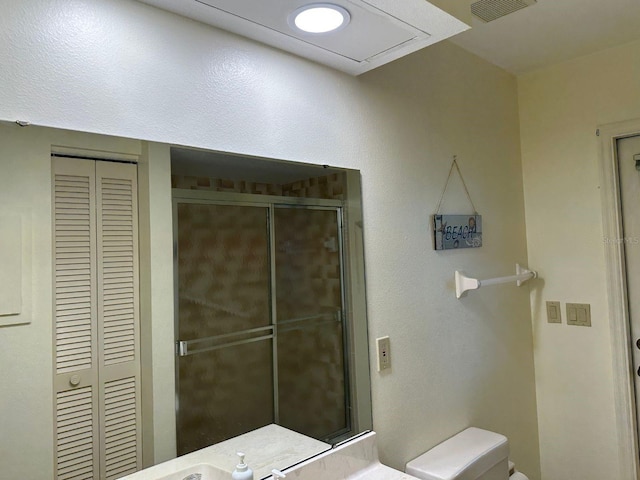 22321 Yonkers Ave, Port Charlotte, FL 33952 - bathroom featuring a closet and a shower with shower door